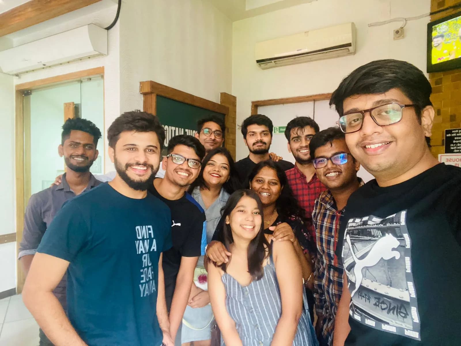 Nirmitee teammates sharing a group selfie