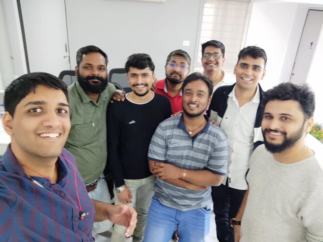 Nirmitee colleagues together in the office